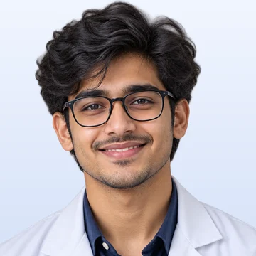 A smiling male medical student with glasses, in a white coat